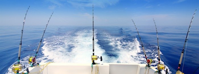 trolling rods across stern of fishing boat